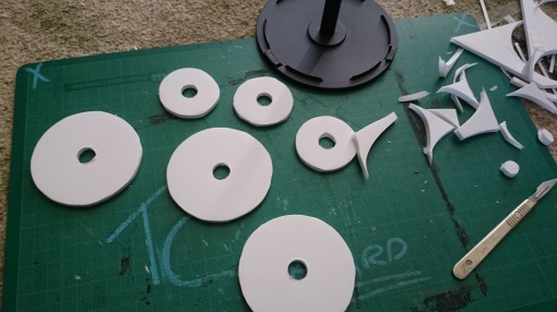 cutting extra padding discs of foamboard